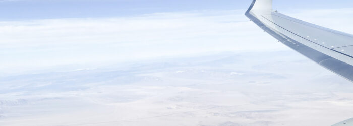 Aeroplane engine and wing in sky